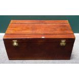An early 20th century teak rectangular travelling trunk, with fitted brass locks,