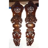 A pair of Chinese wooden panels, pierced and carved with bats, fruit, flowers and bamboo,