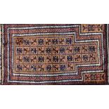 A Beluchistan prayer rug, the pale brown mehrab with squared sections of single flowerheads,