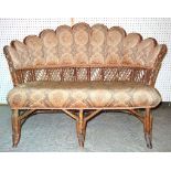 An Edwardian fan/peacock back wickerwork sofa, 123cm wide.