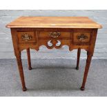 A mid-19th century walnut lowboy with two drawers about the pierced frieze on tapering turned