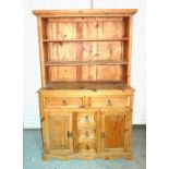 A 20th century hardwood dresser with two tier top,