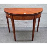 A George III inlaid mahogany semi-elliptic tea table on tapering square supports,