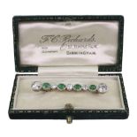 An emerald and diamond bar brooch,