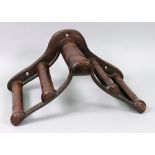 Musgrave & Co Ltd, Belfast and London; 19th century cast iron and mahogany child's saddle rack,