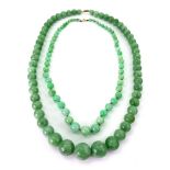 A mottled green jade graduated bead single row necklace, approx.