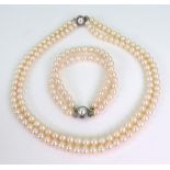 A cultured pearl double row necklace, with cultured pearl clasp approximately 41cm in length,