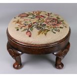 An early 20th century George I style walnut upholstered footstool, with drop in seat,