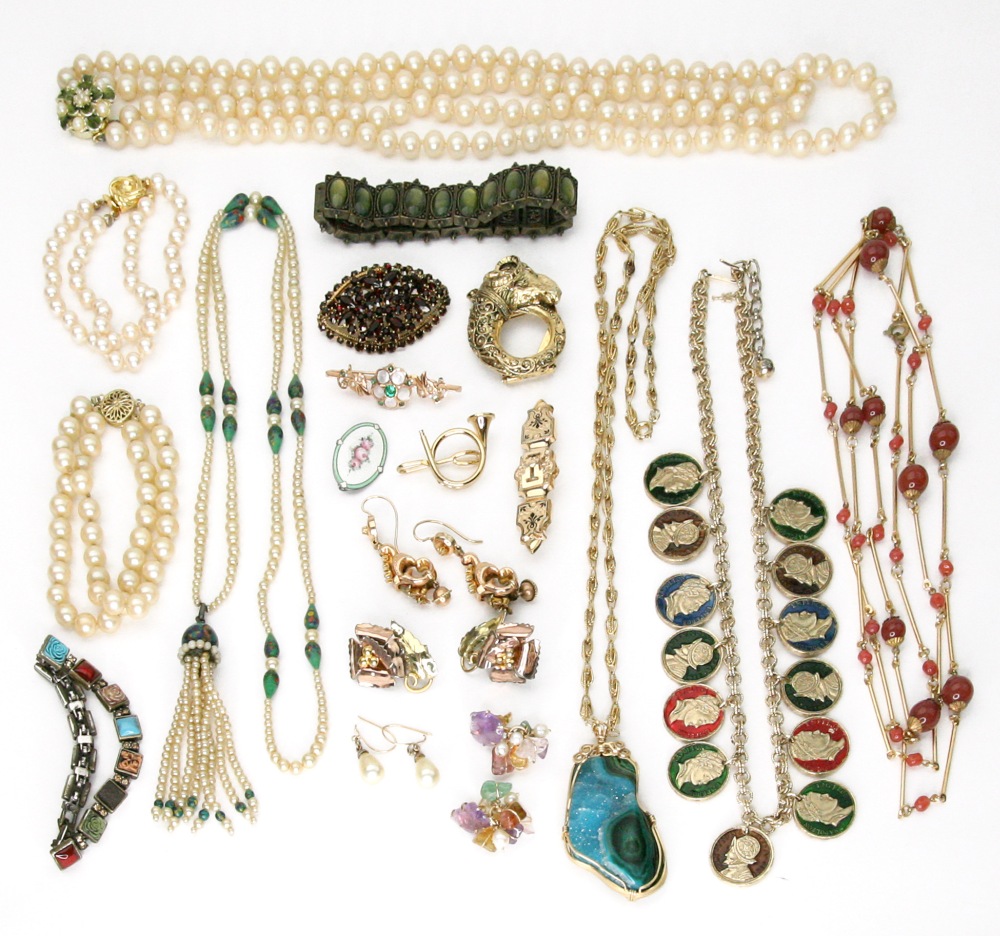 A collection of costume jewellery, including; a peach gemset necklace,