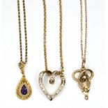 A gold and diamond heart shaped pendant, stamped 10K,