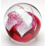 A large Caithness glass paperweight, Double Magnum Crimson, 15cm diameter,