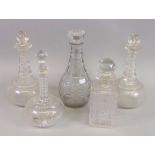 A pair of Victorian glass decanters, with faceted ring necks and compressed circular bodies,