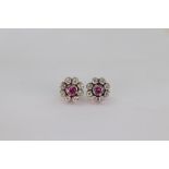 A pair of white gold, diamond and pink gemset cluster earrings,