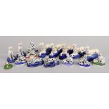 A collection of fifteen reproduction pottery and porcelain figures of Dalmatians and one other (16).