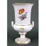 A Meissen porcelain campana shape vase, 20th century, painted with a bouquet and scattered flowers,