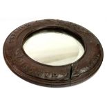 Winchester Interest; a late Victorian circular oak wall mirror,