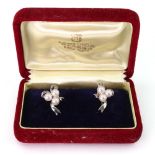 A pair of silver Mikimoto cultured pearls earrings,