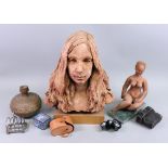 A contemporary terracotta bust of a young girl with long hair, on wooden plinth, 43cm long,