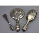 An Edwardian silver mounted hand mirror,