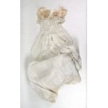 A hand made lace & silk christening gown