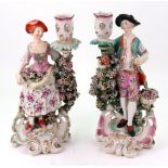 Two Derby porcelain candlestick figures, circa 1770, modelled as a young man and companion,