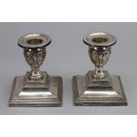 A pair of Edwardian silver dwarf candles