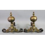 A pair of brass and wrought metal fire d