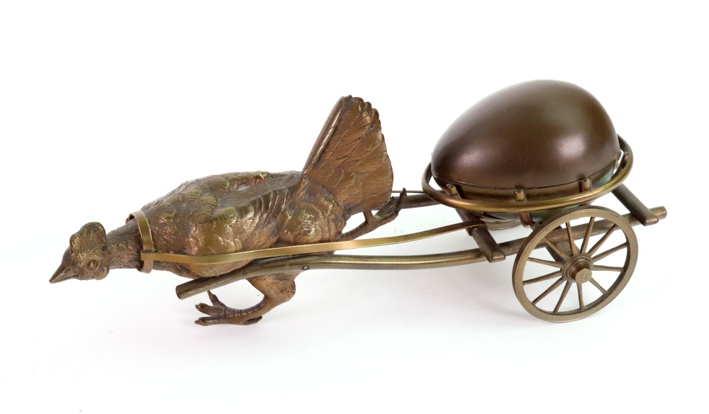 A novelty gilt metal inkwell, late 19th century, probably French, in the form of an egg,