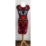 Alexander McQueen; a rayon and polyamide dress, with printed pattern of orange,