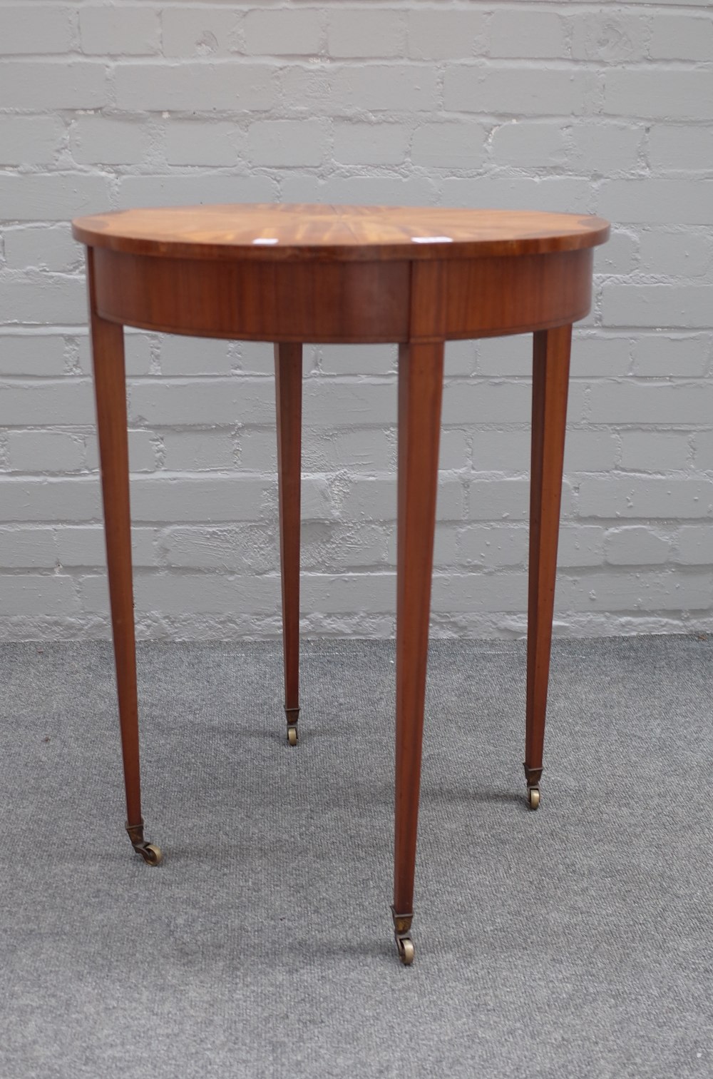 An Edwardian satinwood occasional table,