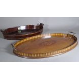 A 19th century oval mahogany twin handled tray, 56cm wide and another 50cm wide.