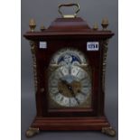 A modern walnut cased Vienna regular mantel clock (35cm high),