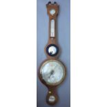 A late 19th century mahogany wheel barometer,