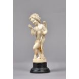 A Dieppe carved ivory 'cupid' figure, early/mid-19th century,