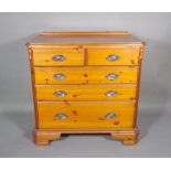 A 20th century pine chest of two short and three long graduated drawers, 90cm wide x 92cm high.