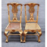 A set of six 18th century Venetian style parcel gilt cream painted dining chairs on ball and claw