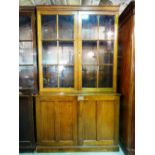 An early 20th century mahogany two door bookcase cabinet 125cm wide x 208cm high.
