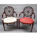 A pair of 20th century "spider web" back open armchairs on tapering square supports,