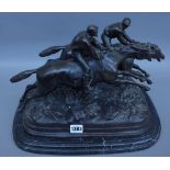 A modern equestrian bronze group, modelled and cast as two racing jockeys atop their mounts,