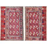 A pair of Uzbek Juvals, each with a madder field, three rows of four guls, cross motifs,