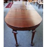 An 18th century and later mahogany extending dining table with pair of 'D' end sections,