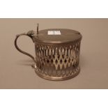 A George III silver mustard pot, of cylindrical form with pierced decoration,
