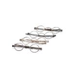 Four pairs of Georgian silver spectacles with oval lenses, early 19th century,