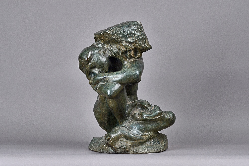 A verde patinated bronze female nude, early 20th century modelled seated,