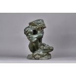 A verde patinated bronze female nude, early 20th century modelled seated,