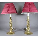 A pair of 20th century brass table lamps on twisted column and octagonal base, 63cm high, (2).