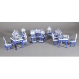 A suite of 20th century Dutch miniature porcelain tables and chairs, (qty).