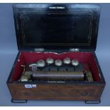 Four Swiss walnut cased cylinder music boxes, 19th century, each with mechanical movement. (a.f.