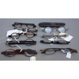 Nine pairs of tortoiseshell spectacles with oval lenses, 19th century, four with turn pin arms,
