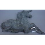 A pair of 19th century lead relief cast plaques depicting lion and unicorn, 68cm wide, (2).